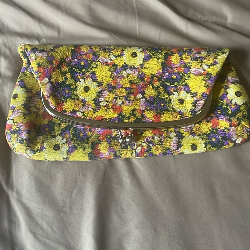 NWOT. HOBO clutch. Has one outside pocket. Zippered pocket 6 cc slots .